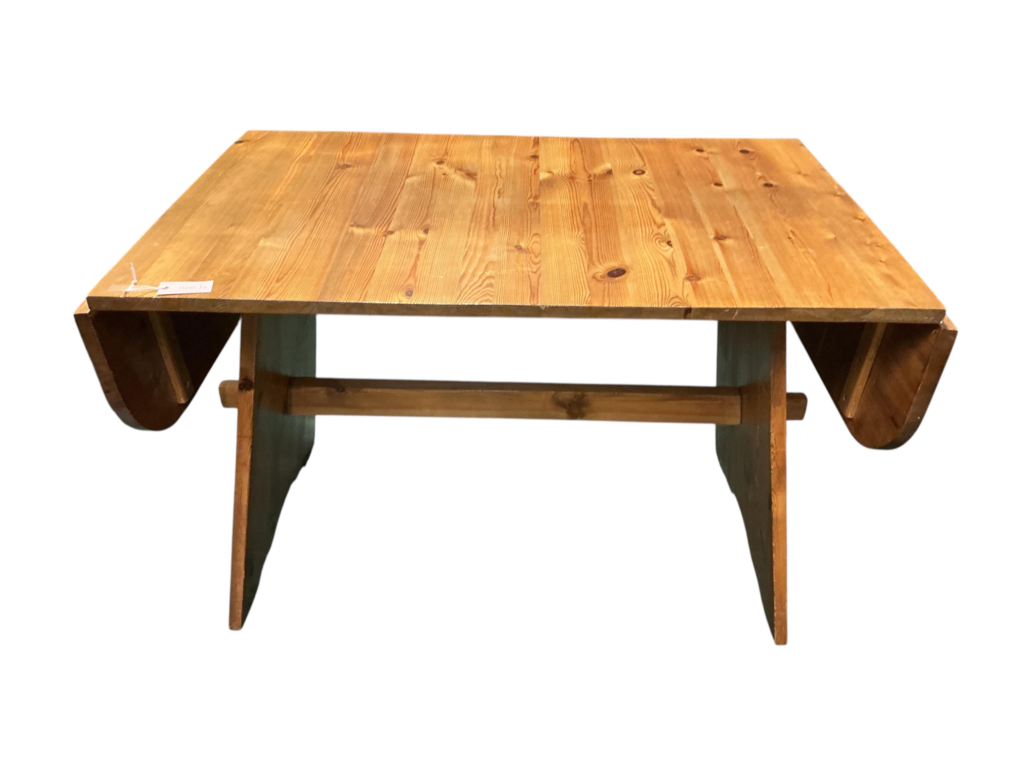 A Spanish style pine drop flap dining table, width 120cm, depth 78cm, height 75cm